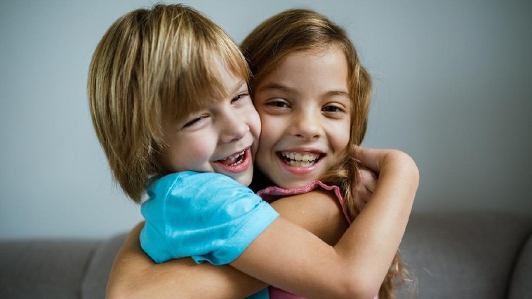 1201675987 Happy children hug each other