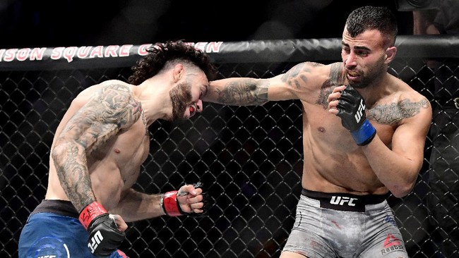 NEW YORK, NEW YORK - NOVEMBER 02: Shane Burgos of the United States (L) fights against Makwan Amirkhani of Finland in the Light Heavyweight bout during UFC 244 at Madison Square Garden on November 02, 2019 in New York City.   Steven Ryan/Getty Images/AFP