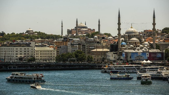 The Byzantine-era Hagia Sophia, one of Istanbul's main tourist attractions in the historic Sultanahmet district of Istanbul, is seen, top center, Saturday, July 11, 2020. Turkey's President Recep Tayyip Erdogan formally reconverted Hagia Sophia into a mosque and declared it open for Muslim worship, hours after a high court annulled a 1934 decision that had made the religious landmark a museum.The decision sparked deep dismay among Orthodox Christians. Originally a cathedral, Hagia Sophia was turned into a mosque after Istanbul's conquest by the Ottoman Empire but had been a museum for the last 86 years, drawing millions of tourists annually. (AP Photo/Emrah Gurel)