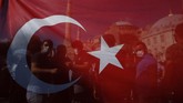 Pro Kontra Hagia Sophia Menjadi Masjid People, ween through a Turkish flag, gather following Turkey's Council of State's decision, outside the Byzantine-era Hagia Sophia, one of Istanbul's main tourist attractions in the historic Sultanahmet district of Istanbul, Friday, July 10, 2020.Turkey's highest administrative court issued a ruling Friday that paves the way for the government to convert Hagia Sophia - a former cathedral-turned-mosque that now serves as a museum - back into a Muslim house of worship. The Council of State threw its weight behind a petition brought by a religious group and annulled a 1934 cabinet decision that changed the 6th century building into a museum. (AP Photo/Emrah Gurel)