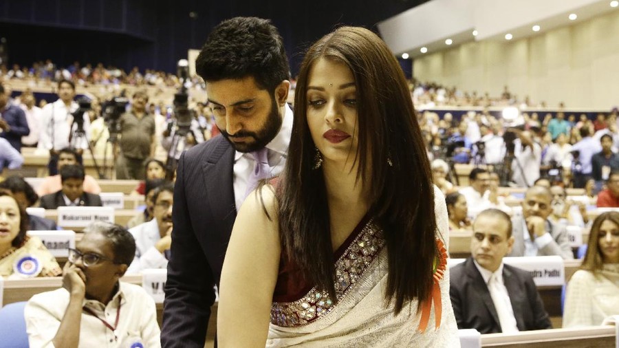 FILE- In this May 3, 2016 file photo, Bollywood couple Abhishek Bachchan, behind and Aishwarya Rai Bachchan arrive to attend the national film awards presentation ceremony in New Delhi, India. Bollywood superstar Amitabh Bachchan, his son Abhishek and two other family members including Aishwarya have tested positive for the coronavirus in Mumbai, India’s financial and entertainment capital, a government minister said Sunday. (AP Photo/Saurabh Das, File)