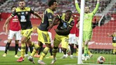 APTOPIX Britain Soccer Premier League Southampton's Michael Obafemi, 20, celebrates after scoring his team's second goal during the English Premier League soccer match between Manchester United and Southampton at Old Trafford in Manchester, England, Monday, July 13, 2020. (AP Photo/Dave Thompson,Pool)