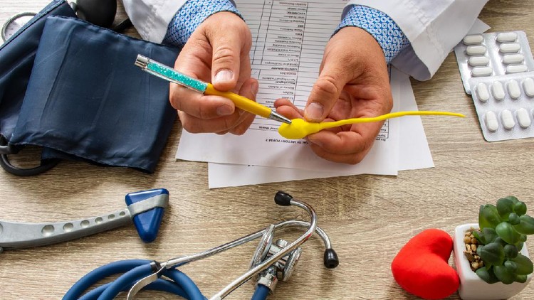 Doctor during consultation held in his hand and shows patient anatomical model of male sperm. Counseling of men and couples about male infertility, sperm pathology, impossibility to get pregnant