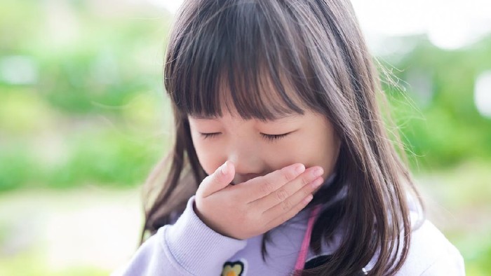 cute little girl get cold and feel vomit, asian