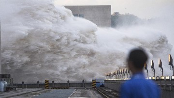 In this photo released by Xinhua News Agency, floodwaters are discharged at the Three Gorges Dam in central China's Hubei province on Sunday, July 19, 2020. Authorities in the neighboring province of Anhui blasted a dam Sunday to release surging waters behind it amid widespread flooding across the country that has claimed scores of lives. (Xiao Yijiu/Xinhua via AP)