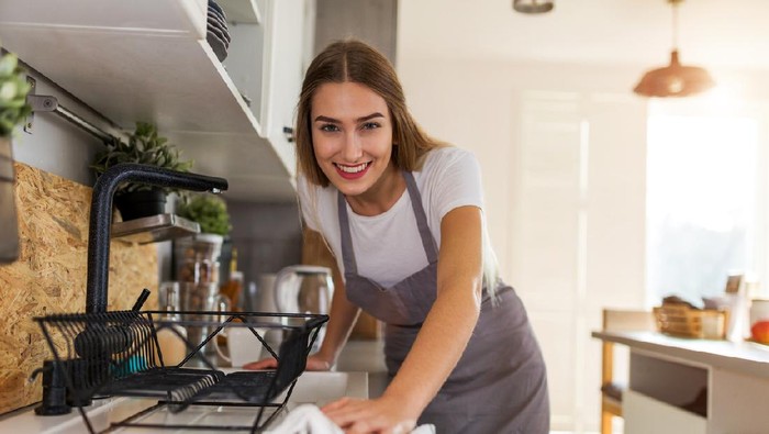 Woman Cleaning Kitchen Counter