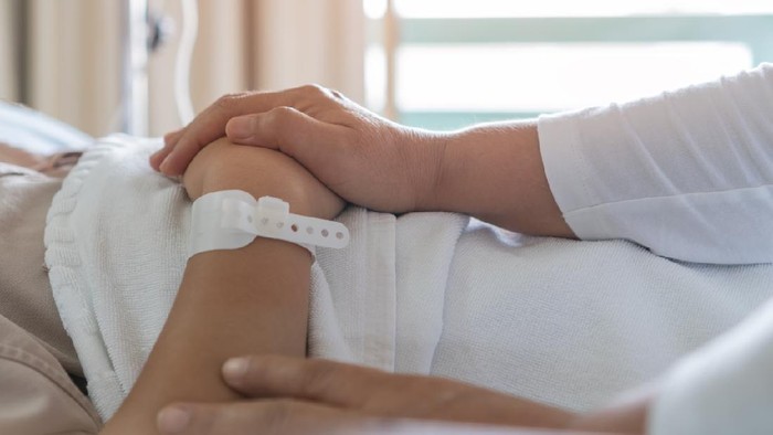 Hopeful and Sad emotional concept, Couple women hold hands lover that sick lying in Hospital bed for sleeping with love emotional, Encouragement comforting Recovering from family healthy Moment