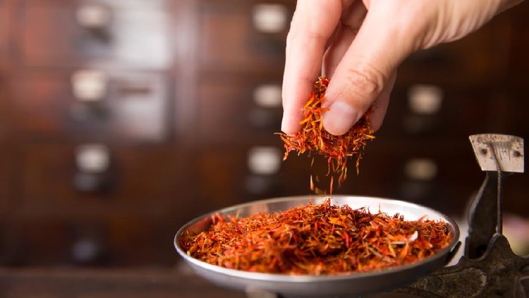 Safflower for diet tea and healthy low fat cooking oil herbal in herb store background
