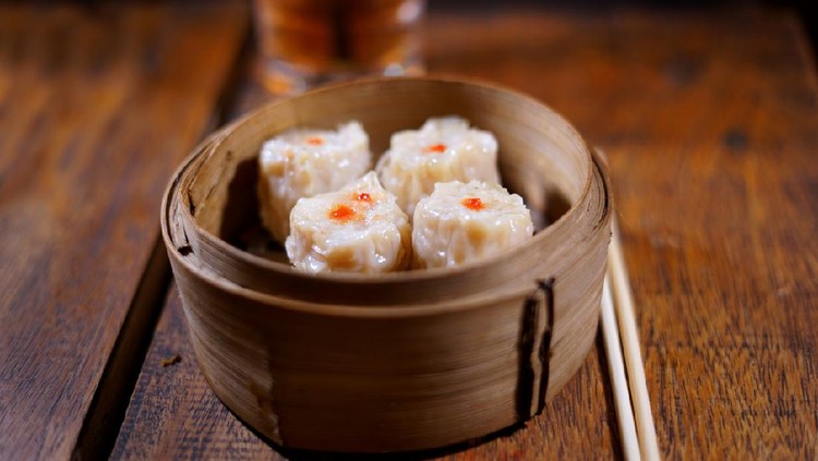 Steamed dumplings Dim Sum on wooden table