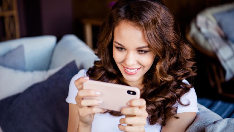 Close-up portrait of her she nice attractive lovely cute charming lovable sweet shine cheerful cheery wavy-haired girl browsing chatting at industrial loft wooden brick style interior room.