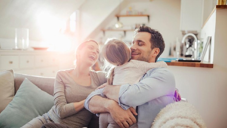 Close up of a happy young family playing at home