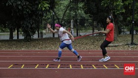 FOTO: Jaga Badan Agar Tak Cedera Saat Olahraga
