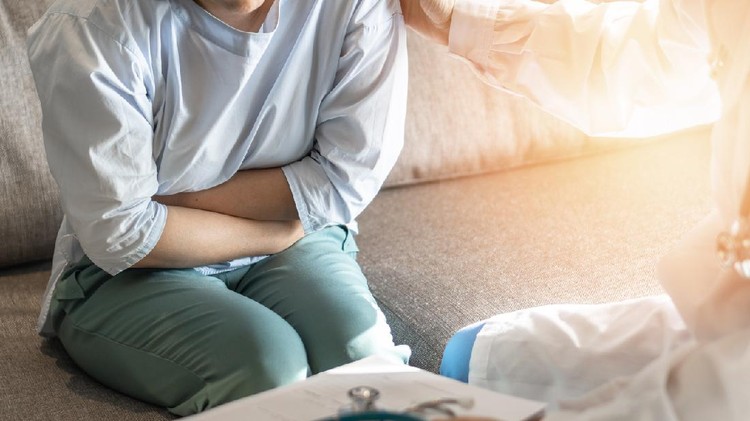 1183657548 Abdominal pain patient woman having medical exam with doctor on illness from stomach cancer, irritable bowel syndrome, pelvic discomfort, Indigestion, Diarrhea, GERD (gastro-esophageal reflux disease)