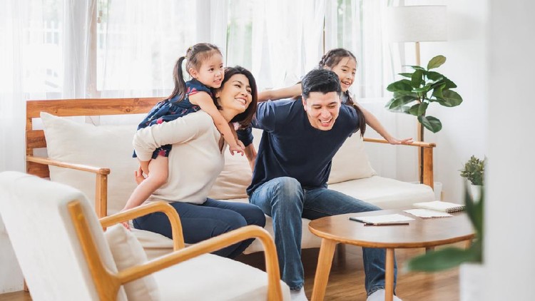 Ilustrasi keluarga Happy Asian family playing together at sofa, home living room