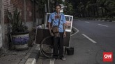 FOTO: Suara Wong Cilik di Tengah Lika-Liku Covid-19 Penutupan kantor, tempat wisata, hingga hiburan karena PSBB Jakarta telah memengaruhi sejumlah pekerja informal yang turut menggantungkan hidup di sana.
