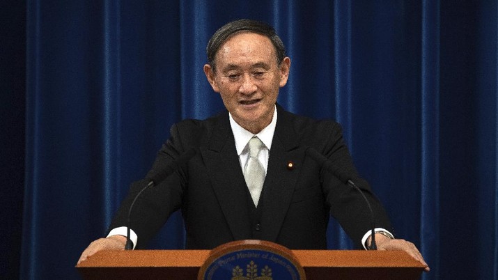 Japan's new Prime Minister Yoshihide Suga speaks during a press conference at the prime minister's official residence Wednesday, Sept. 16, 2020 in Tokyo, Japan.  Suga, who was elected on Wednesday after gaining support for his pledges to pursue his predecessor Shinzo Abe's policies formed his 20-member Cabinet that retains many familiar faces, signaling continuation of Abe's line. (Carl Court/Pool Photo via AP)