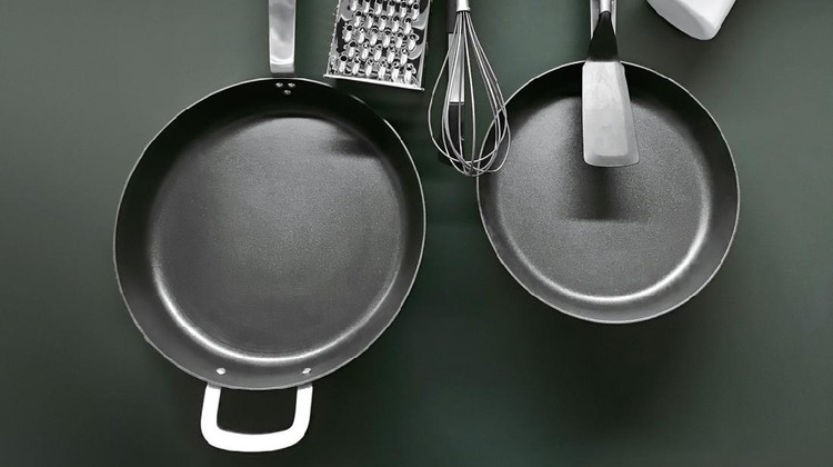 Cooking utensils hanging on a pot rack