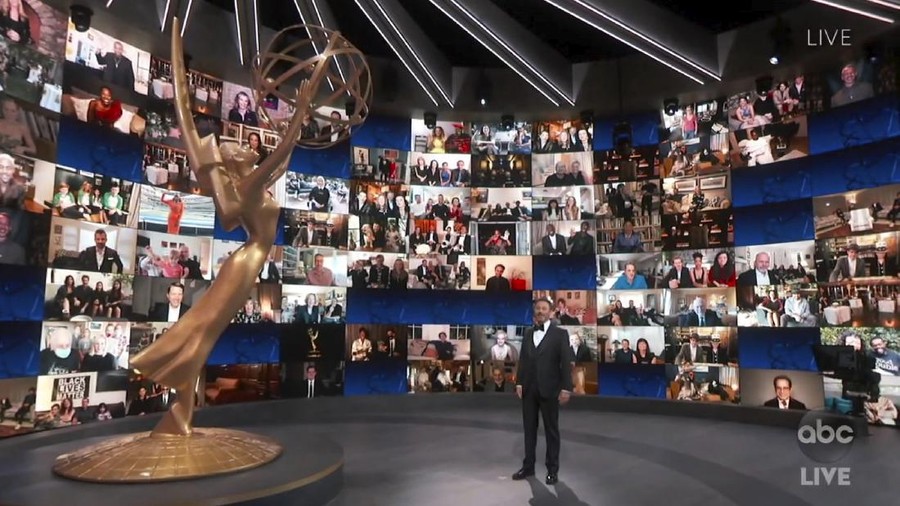 In this video grab captured on Sept. 20, 2020, courtesy of the Academy of Television Arts & Sciences and ABC Entertainment, host Jimmy Kimmel appears with a screen filled with nominees during the 72nd Emmy Awards broadcast. (The Television Academy and ABC Entertainment via AP)