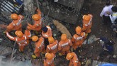FOTO: Bangunan 4 Lantai di Mumbai Runtuh, 15 Tewas Korban tewas akibat bangunan runtuh di pinggiran kota Mumbai, negara bagian Maharashtra, India kini mencapai 15 orang dan 25 orang diduga masih terjebak.