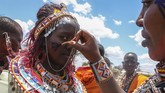 FOTO: Suku Maasai Gelar Upacara Tradisi di Tengah Pandemi Suku Maasai di Kenya menggelar upacara tradisional mereka di tengah pandemi pada Rabu (23/9). (AP Photo)
