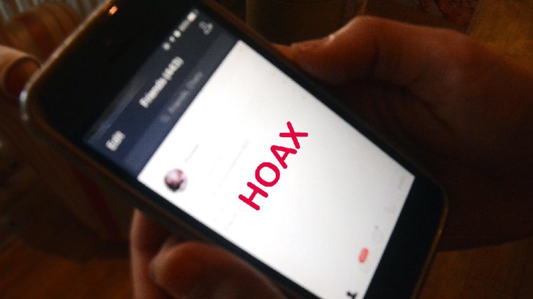 Hands holding mobile phone on blurred background