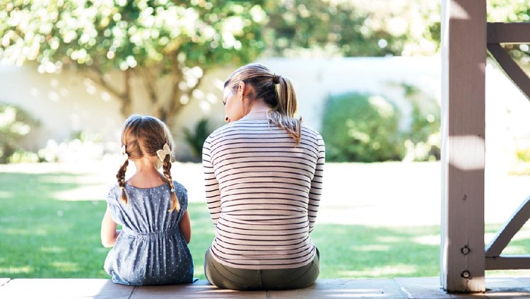 Rearview shot of a young woman and her daughter having a conversation on the porch