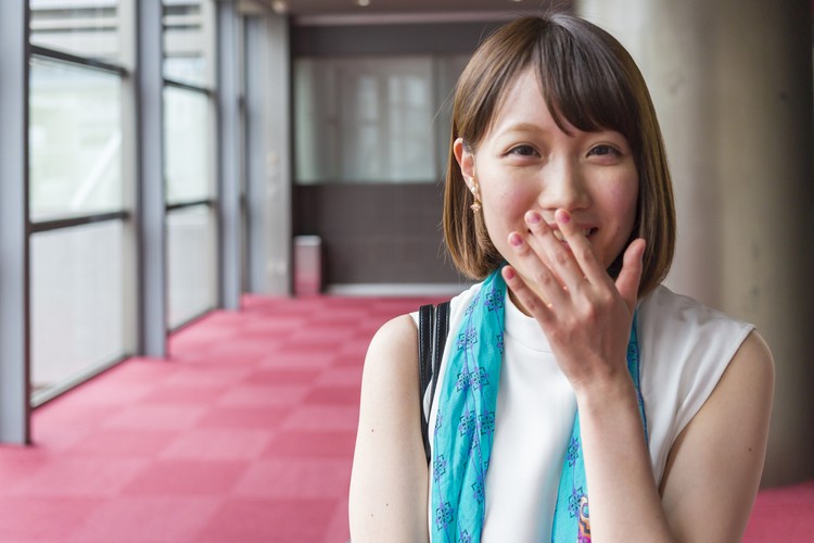 Perempuan Jepang Menutup Mulut Saat Tertawa, Kenapa Ya? Portrait of a young Japanese business woman in a corporate office building in Kyoto Japan