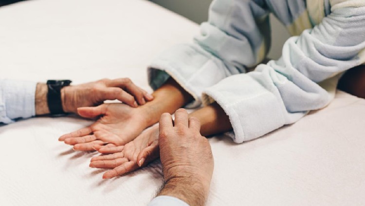 Beautiful young adult woman receiving professional acupuncture and massage treatment.