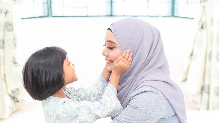 Mother and daughter on Hari Raya Aidilfitri/ Eid-Ul-Fitr in Malaysia.