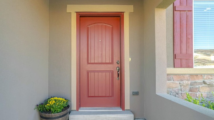 Ilustrasi pintu rumah minimalis Panorama frame The red front door of a house with concrete exterior wall and shutters on window. Doormat and potted flowers are placed by the doorstep.