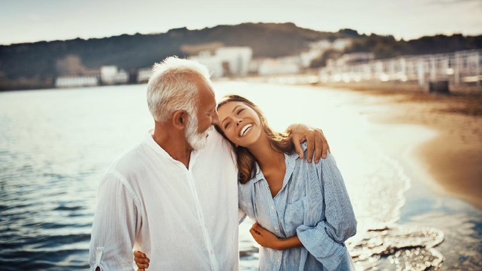 Man holding hands of woman in restaurant