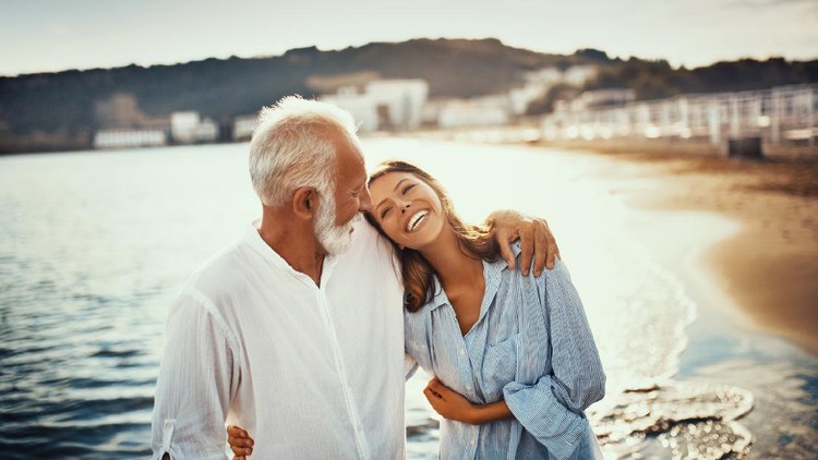 Man holding hands of woman in restaurant