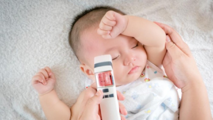 Blurred of image baby sick with thermometer