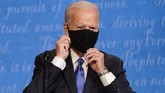 FOTO: Adu Argumen Trump-Biden di Debat Pilpres Terakhir Dua calon presiden AS, Donald Trump dan Joe Biden, menjalani putaran terakhir debat Pilpres AS 2020 di Nashville, Tennessee.