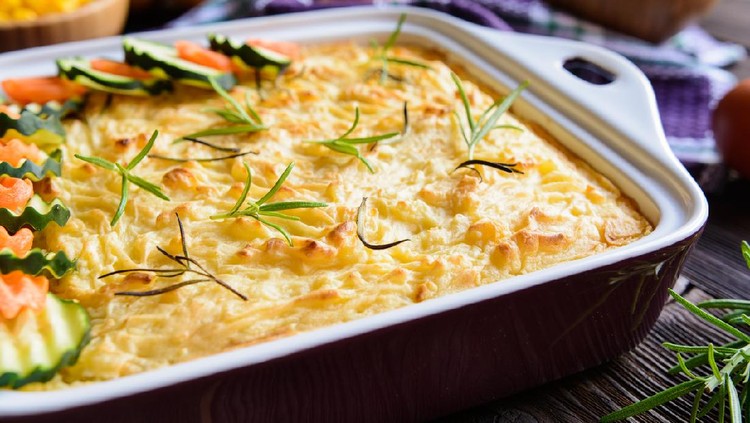 Traditional Shepherd's Pie with minced meat, mashed potatoes, pea, corn and celery