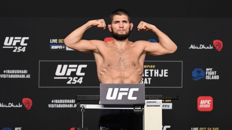 Khabib Nurmagomedov ABU DHABI, UNITED ARAB EMIRATES - OCTOBER 23: In this handout image provided by UFC, Khabib Nurmagomedov of Russia poses on the scale during the UFC 254 weigh-in on October 23, 2020 on UFC Fight Island, Abu Dhabi, United Arab Emirates. (Photo by Josh Hedges/Zuffa LLC via Getty Images)