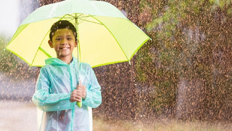 Asian boy with umbrella.