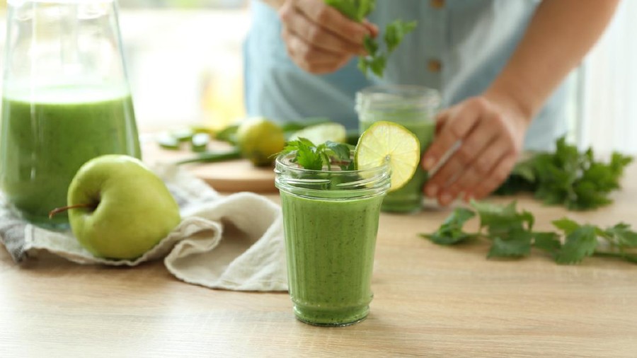 Jar of aloe vera cocktail on wooden table