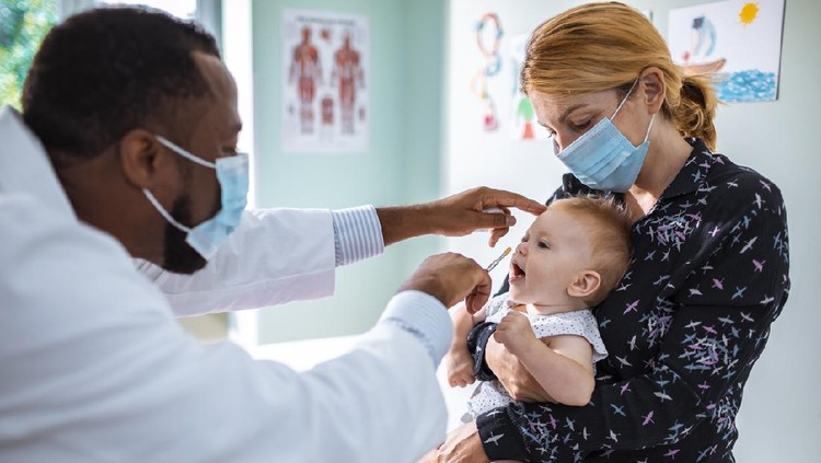 Close up of a pediatrician vaccinating his patient