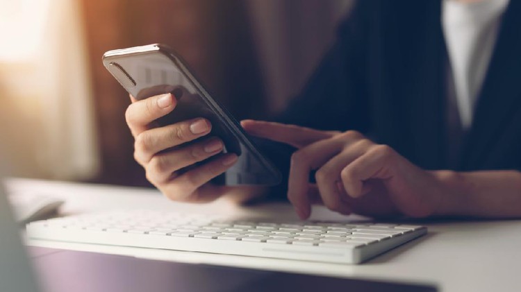 Woman using smartphone. The concept of using the phone is essential in everyday life.