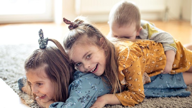 Funny moment. Three little children at home together.