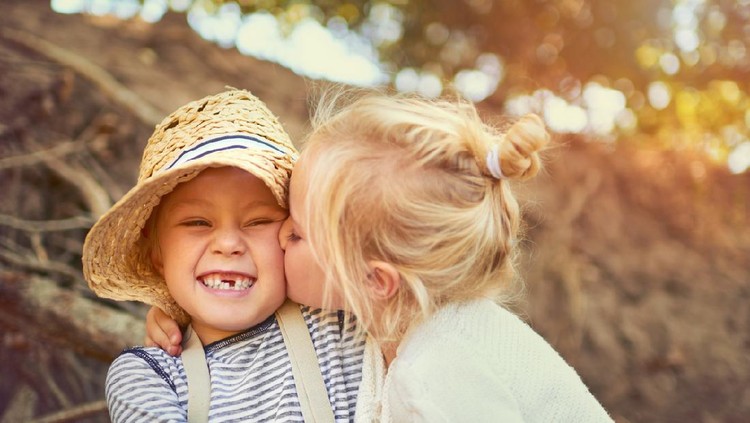Shot of two little children playing together outdoors