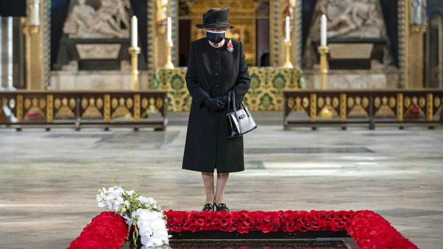 Britain's Queen Elizabeth II attends a ceremony to mark the centenary of the burial of the Unknown Warrior, in Westminster Abbey, London, Wednesday, Nov. 4, 2020. Queen Elizabeth II donned a face mask in public for the first time during the coronavirus pandemic when attending a brief ceremony at Westminster Abbey last week to mark the centenary of the burial of the Unknown Warrior. While the 94-year-old has been seen in public on several occasions over the past few months, she has not worn a face covering. (Aaron Chown/Pool Photo via AP)