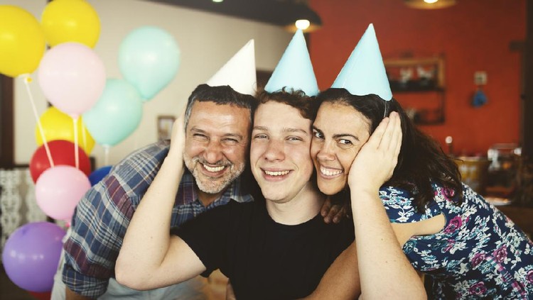 Family together celebrating a birthday party