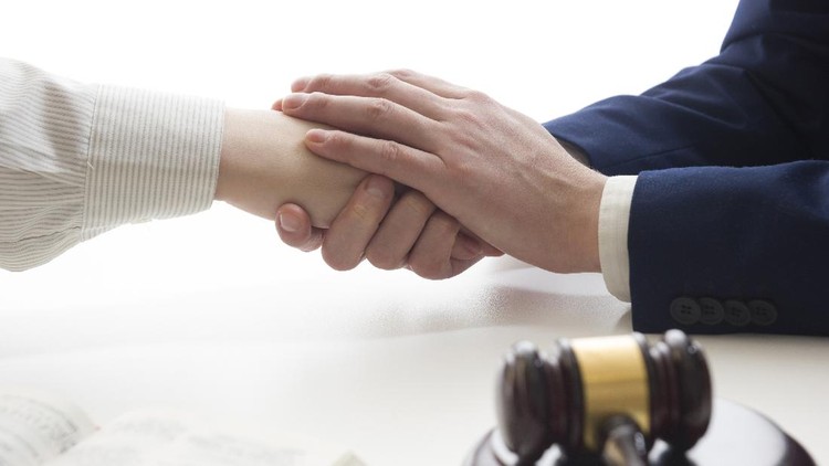 Hands of wife, husband signing decree of divorce, dissolution, canceling marriage, legal separation documents, filing divorce papers or premarital agreement prepared by lawyer. Wedding ring.