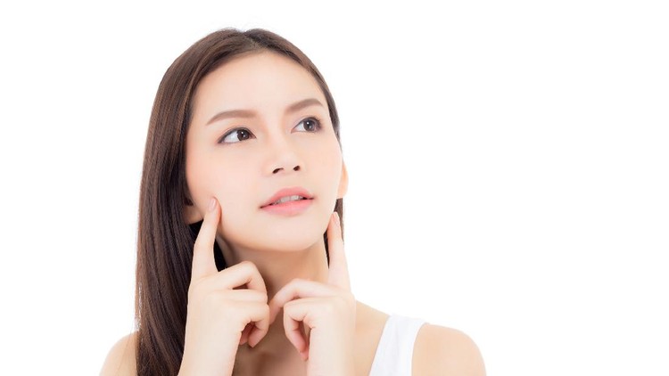 Portrait of beautiful asian woman makeup of cosmetic, girl hand touch cheek and smile attractive, face of beauty perfect with wellness isolated on white background with skin healthcare concept.