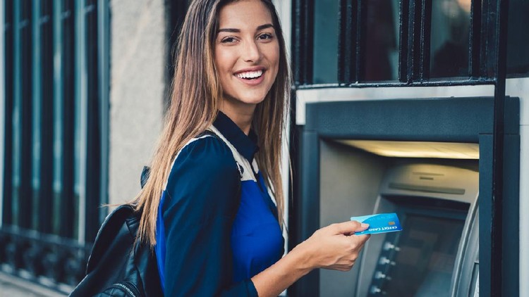 menabung Smiling woman at the ATM ready to withdraw cash money ++++ Note for the inspector: Credit card is fake ++++