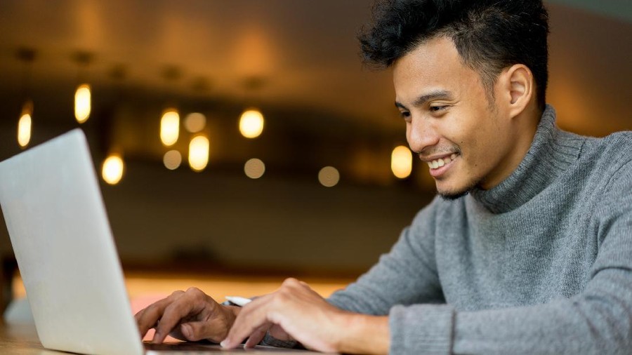 close up businessman typing on keyboard laptop at loft office for search data information and knowledge on web browser concept