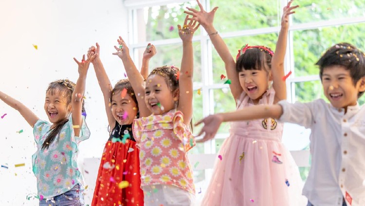 Kids are playing and throwing paper in kid party