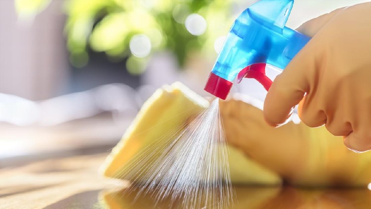 Cleaning with spray detergent, rubber gloves and dish cloth on work surface concept for hygiene